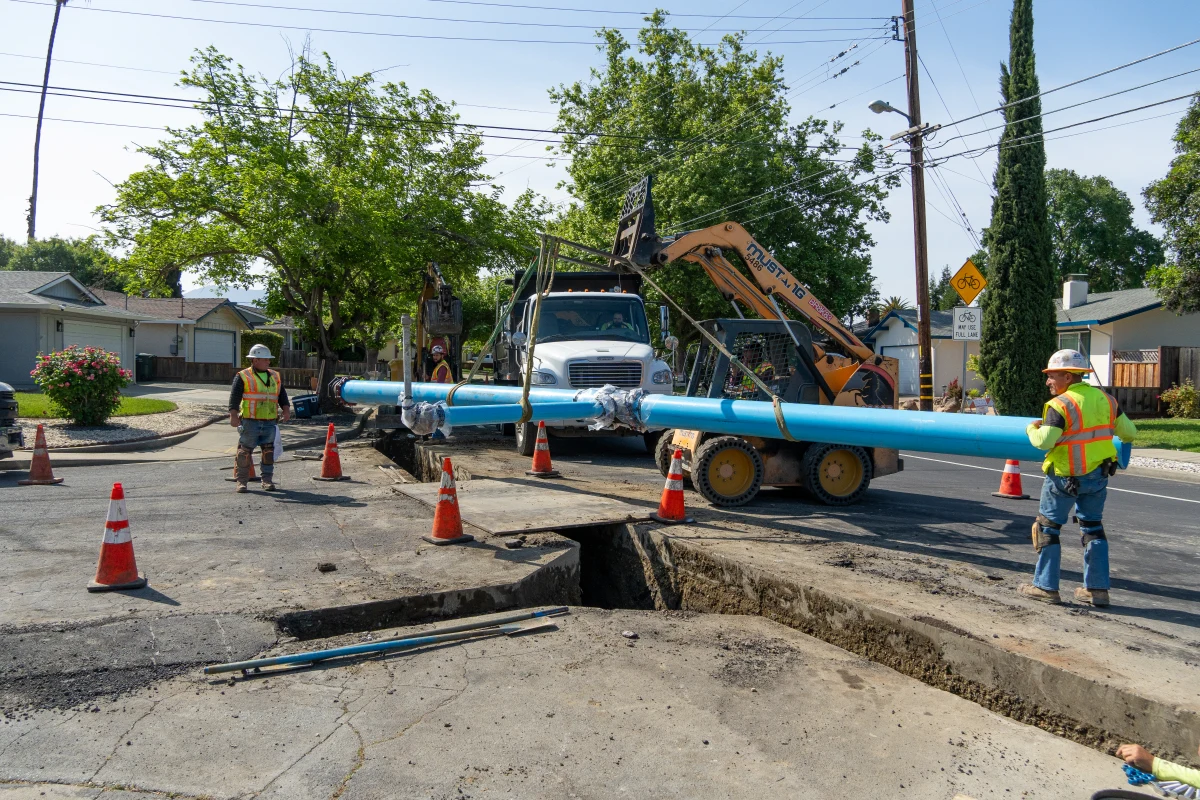 Neighborhood construction installing new water pipes.